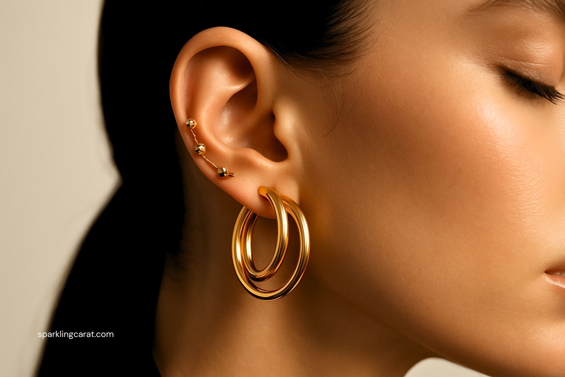 Gold two-in-one double hoop earrings styled for everyday wear.